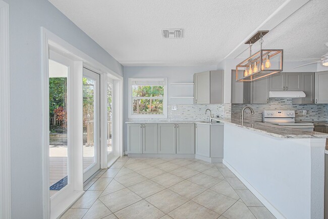 Building Photo - Waterfront 3BR/2BA Home – Walk to Beach + Boat Lift – $500 Off!