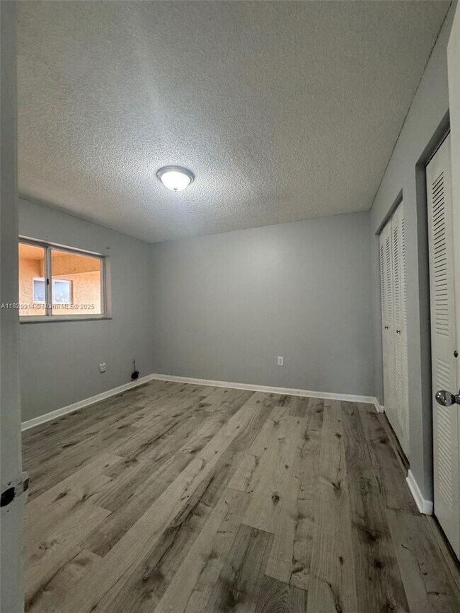 Building Photo - 7965 W 30th Ct