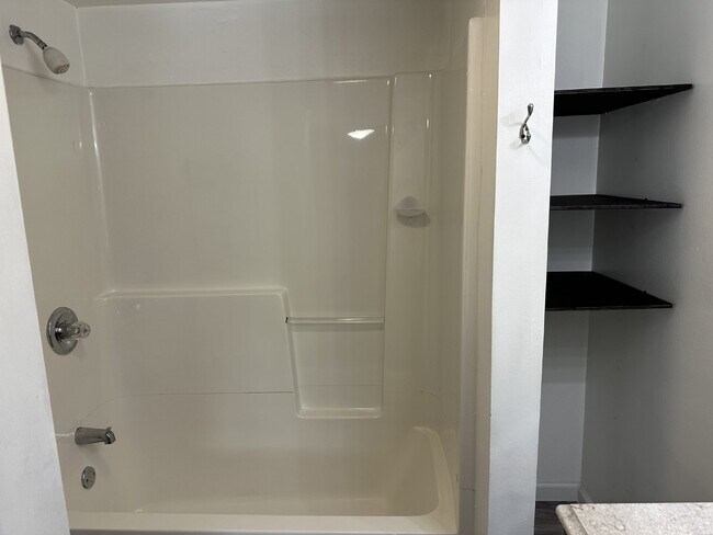 Building Photo - Enjoy an open floor plan in a prime location next to the bus line.