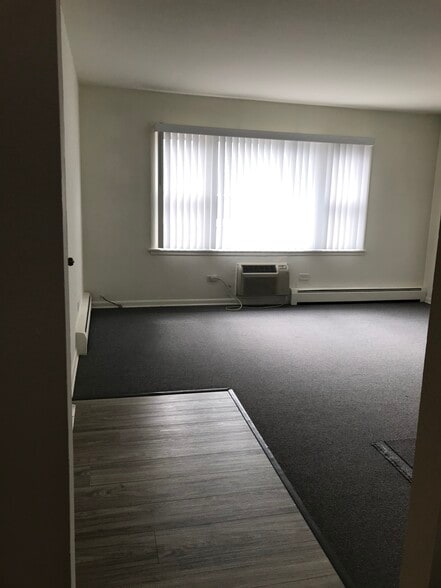 Living room with ample light and new blinds. - 8616 47th St