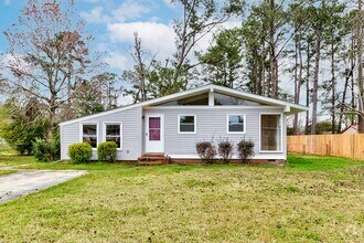 Building Photo - Mid-Century with character Available in July!