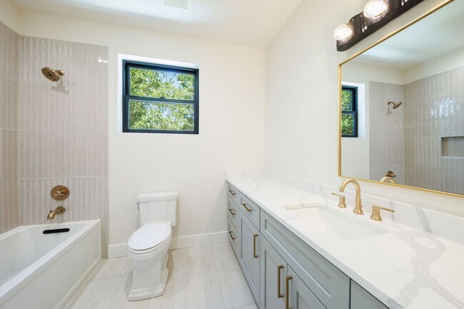 Building Photo - Luxury Redefined: Experience Vibrant Living in this 3-Bedroom Haven in East Austin