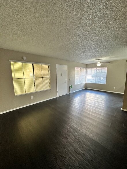 View from corner of the living room towards dining area/kitchen - 7385 Lariat Pl