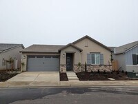 Building Photo - New Wilson home offering modern amenities, solar and a nice floor plan. Bonus room with den or of...