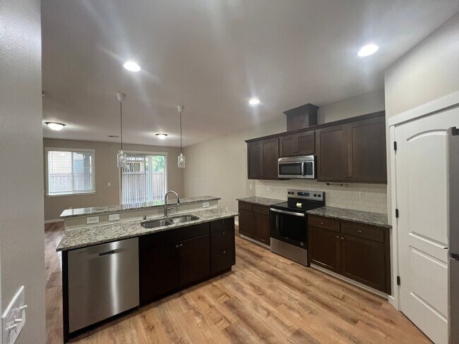 Building Photo - Recently Renovated! Spacious 3 Bedroom Home with Fenced Yard, Patio, and 2-Car Garage With Move I...