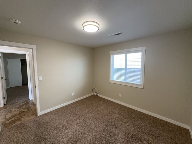 Building Photo - Newley updated 3-bedroom home features fenced yard, garage, and covered patios!