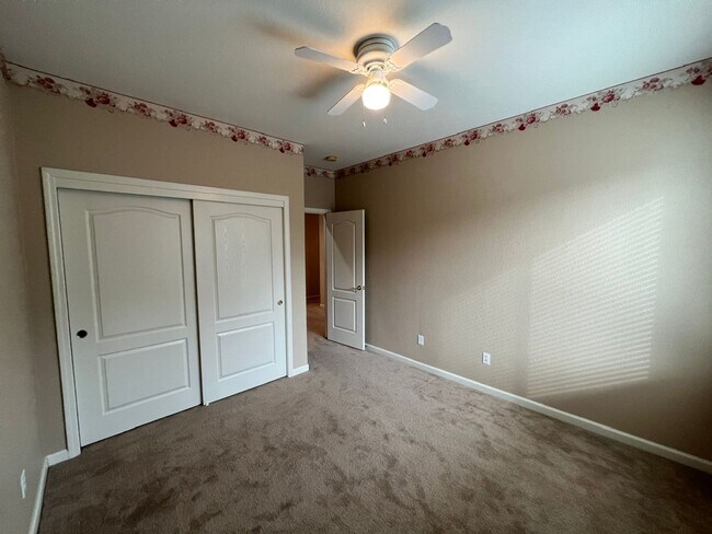 Building Photo - 4 bedrooms with 3 car garage in Rose Lane ...