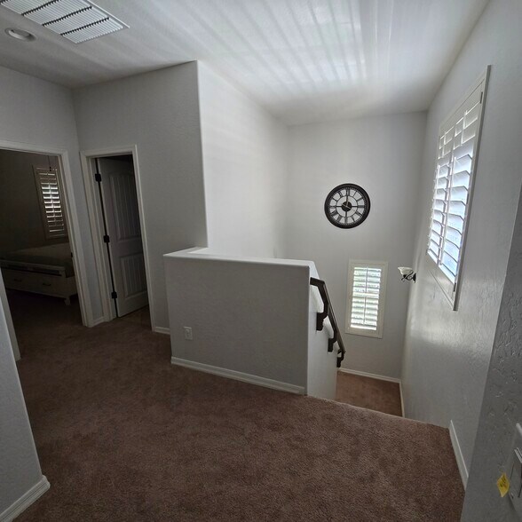 Stairs near full guest bathroom and 2 guest rooms - 280 E Indigo Dr