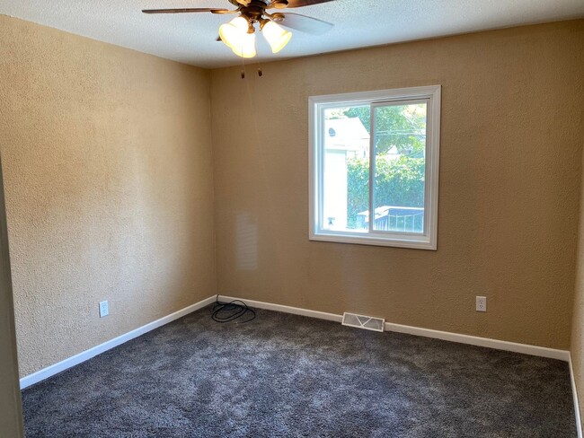 Building Photo - Spacious 4-Bedroom Home with Garage and Backyard in Milan!