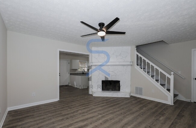 Building Photo - Move in before December 31st and choose your reward: a $250 Amazon Gift Card or a 55" Smart TV!