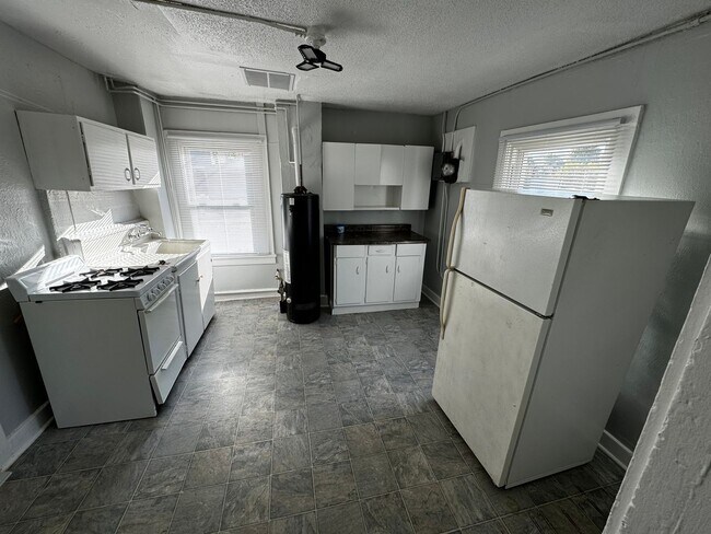 Building Photo - Interested in a two-bedroom house that includes a large garage. Please let us know