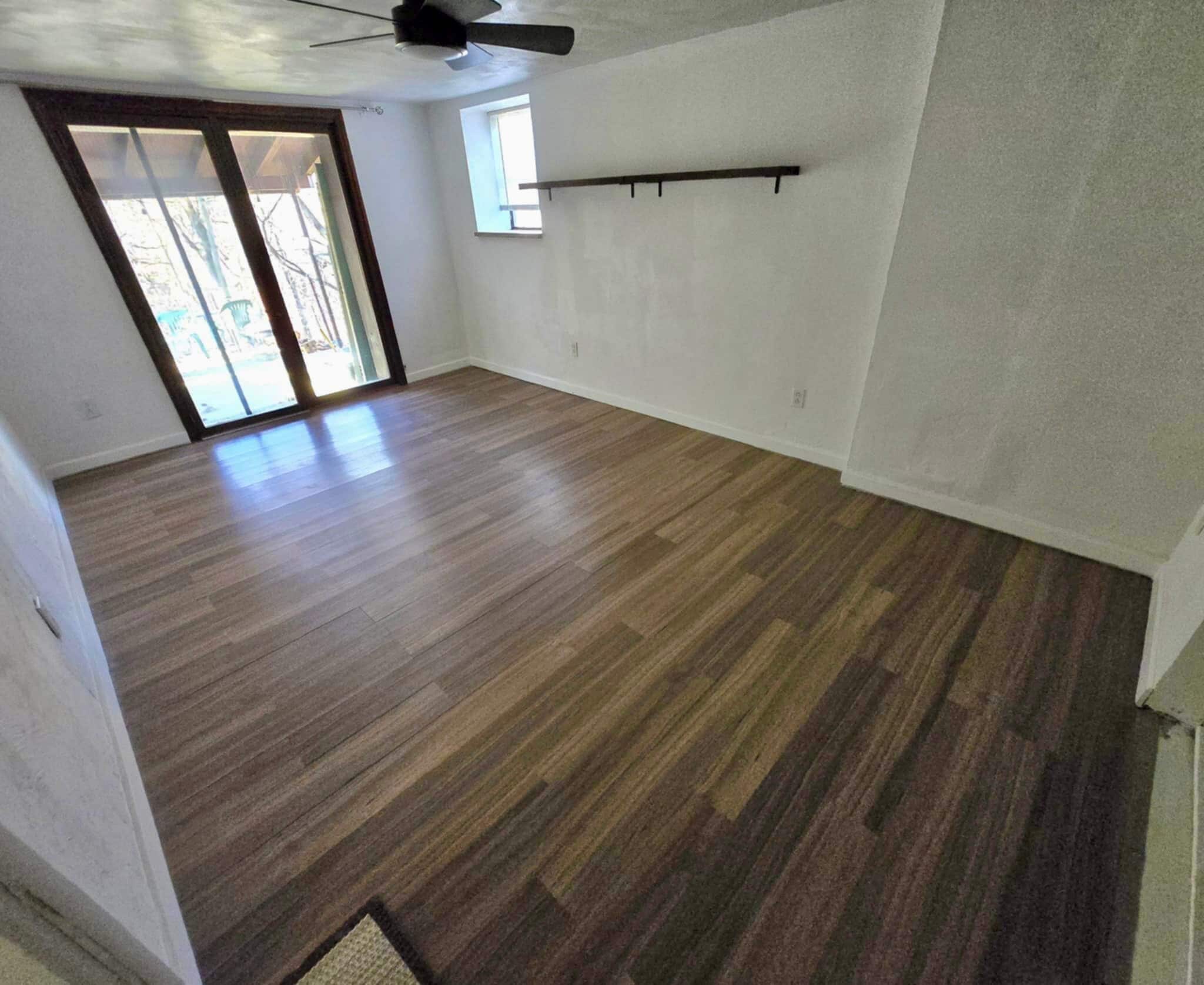 Downstairs bedroom + Door to back porch - 2612 Louisiana Ave