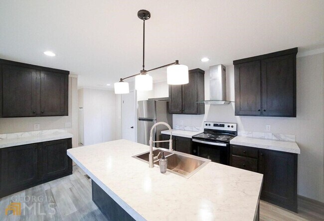 Building Photo - Spacious 4-Bedroom Home with Lawn Maintena...