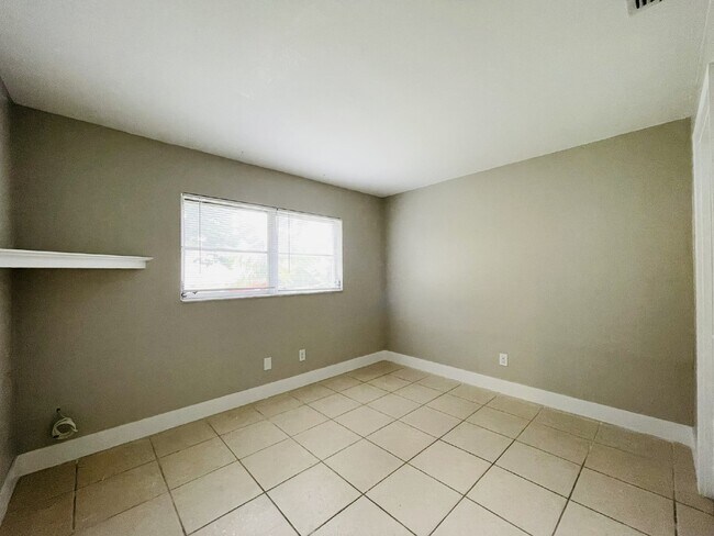 Building Photo - Updated 2-bedroom waterfront duplex with walk-in closets, enclosed Florida room, and canal views ...