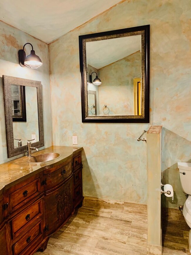 Master bath with copper vanity - 19536 Eric Dr