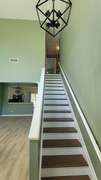 Stair to upper level - 10820 Rumson Ct