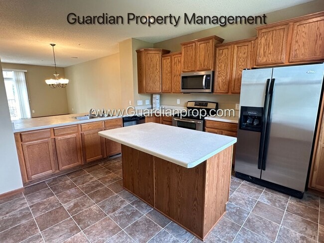 Building Photo - Pet Free Champlin Town Home, 3.5 Baths, 2 Car Garage, Dishwasher, Balcony, Available end of April
