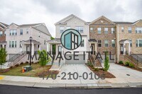 Building Photo - End unit! Gorgeous townhouse in the Suwane...