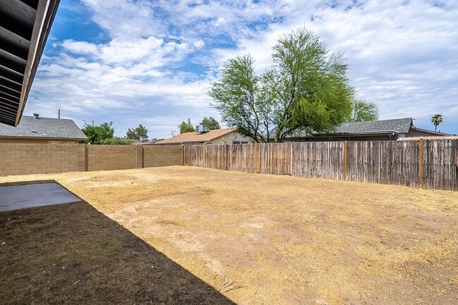 Building Photo - Updated home with large backyard & 2 car g...