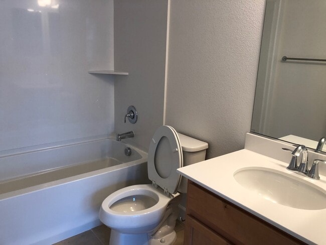 Building Photo - Tri-level Townhome with 2 Car Attached Gar...