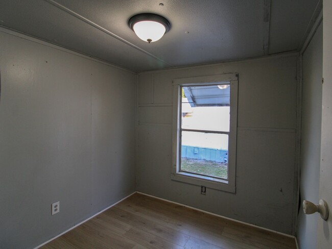 Building Photo - Discover comfortable country living in this nicely updated trailer located just minutes from Faye...