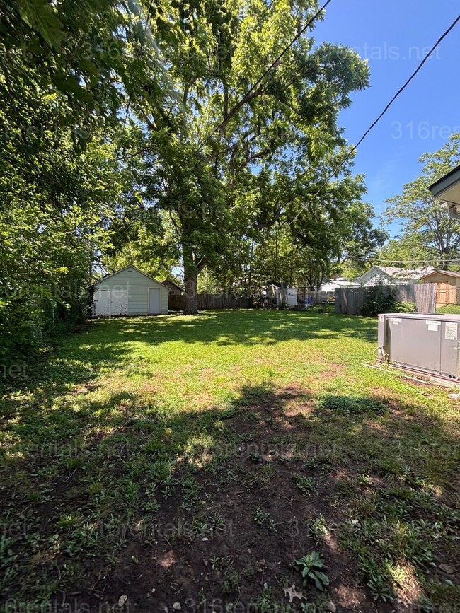 Building Photo - Two bed one bath fenced in yard house available now