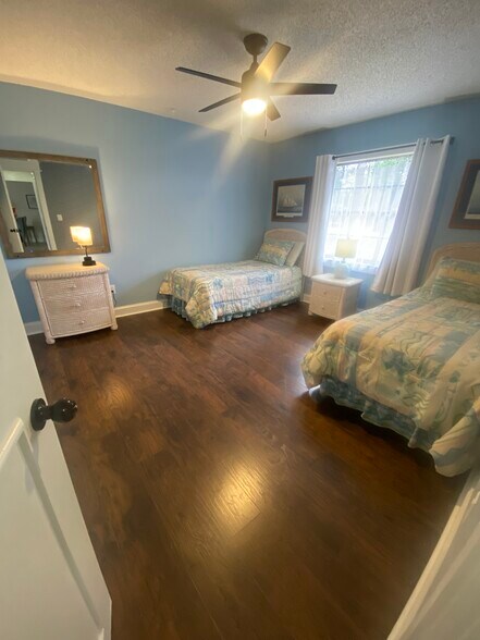 Second bedroom with two twin beds, converts easily to king size bed. - 648 Glenview Dr