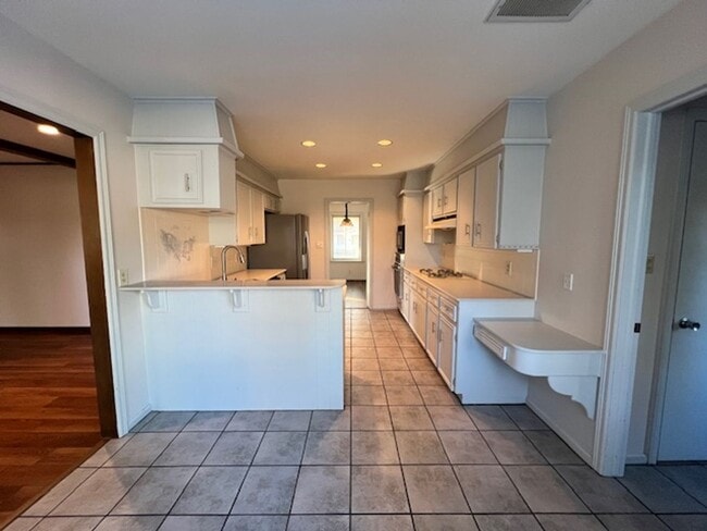 Building Photo - Step into this inviting, sunlit home where space and comfort blend seamlessly