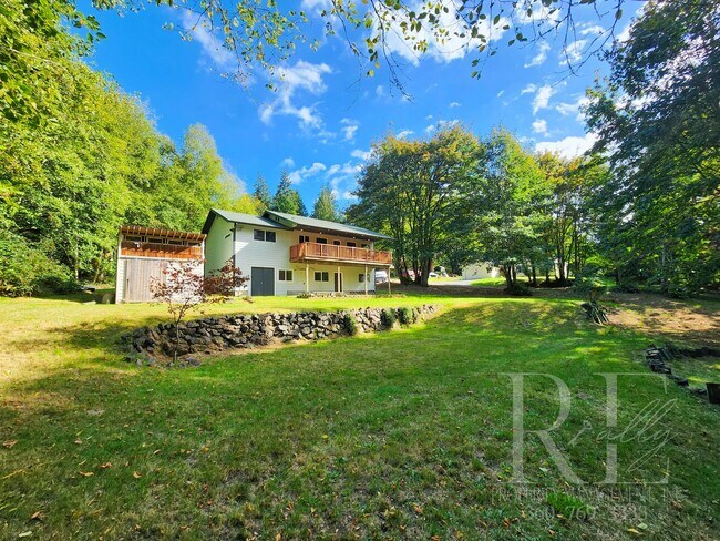 Building Photo - Vaulted Ceilings, Unique Designer Kitchen & Expansive Half-Acre Setting with Flexible Living Spaces