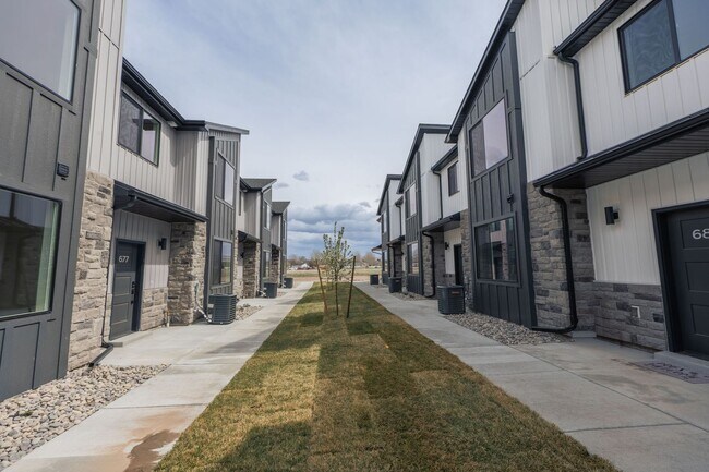 Building Photo - $300 off first month for February move-ins - BRAND NEW 3 BED 2.5 BATH TOWNHOMES WITH 2 CAR GARAGE