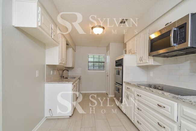 Building Photo - Turn the key. Enter. Smile. Repeat every day!