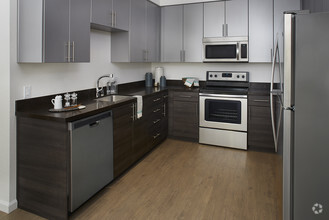 A selection of interior finishes available with luxury faux wood flooring & stainless steel appliances - LINQ