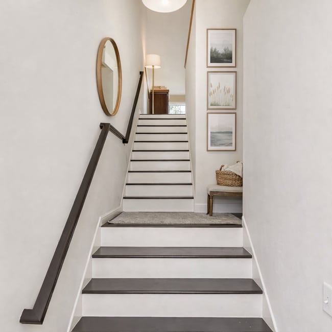 Beautiful staircase leading to the main living space. - 1102 Bergmann Dr