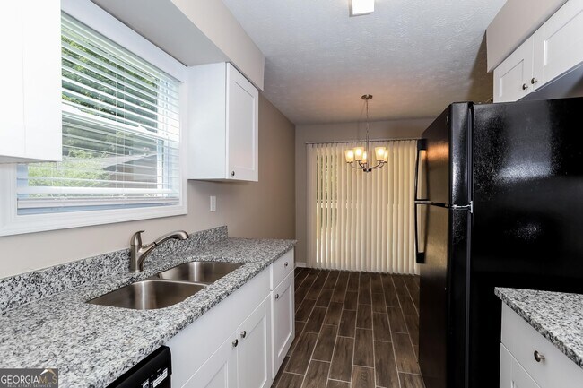 Building Photo - 9073 Woodgreen Way