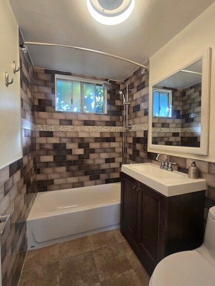 remodeled bathroom with tub - 4761 W 169th St