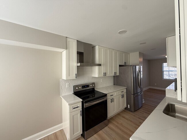Building Photo - New Everything 4BR Townhome with Private Lower Level Suite | Stainless Kitchen | LVP + New Carpet...