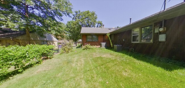 Building Photo - 3D Tour Available! West Side Home + Sunroom + Attached Garage + Pets Welcome + Washer & Dryer!  A...
