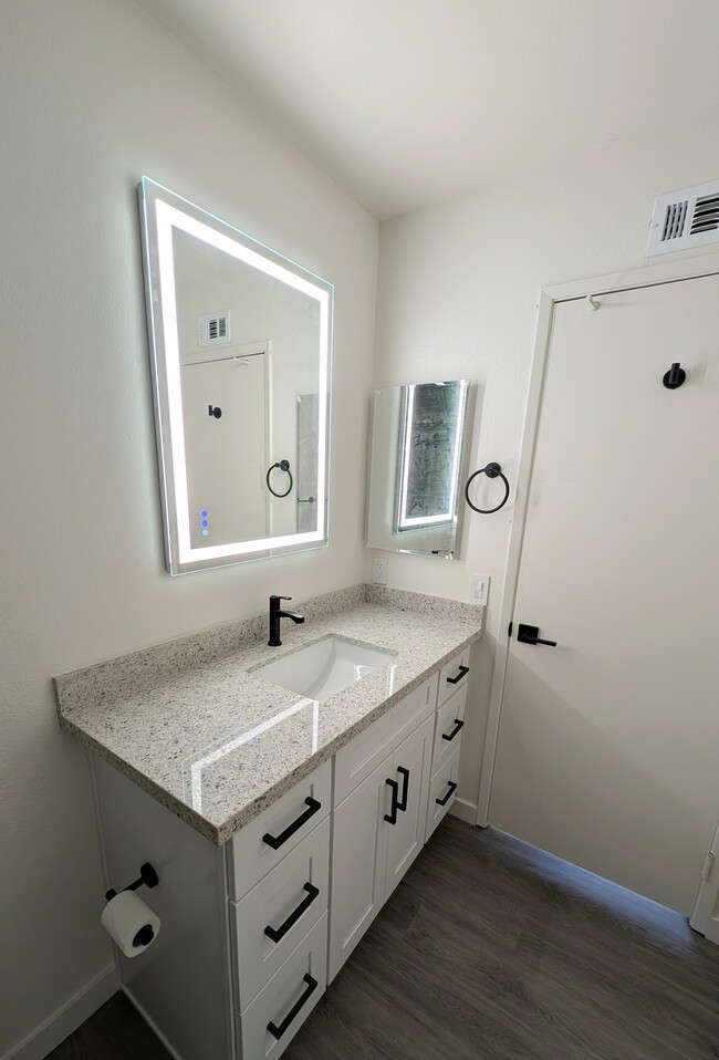 Main bathroom with new mirror and medicine cabinet - 19050 Kittridge St