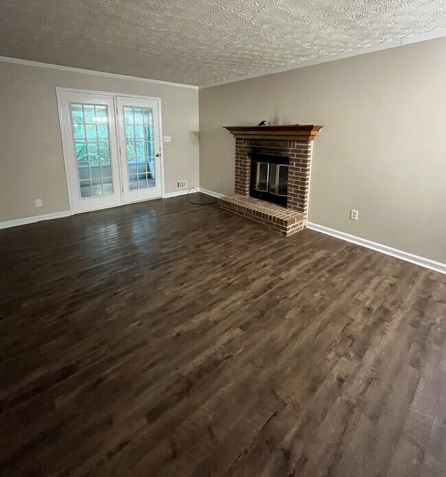 Living Room with doors leading to lanai - 440 Williamsburg Way