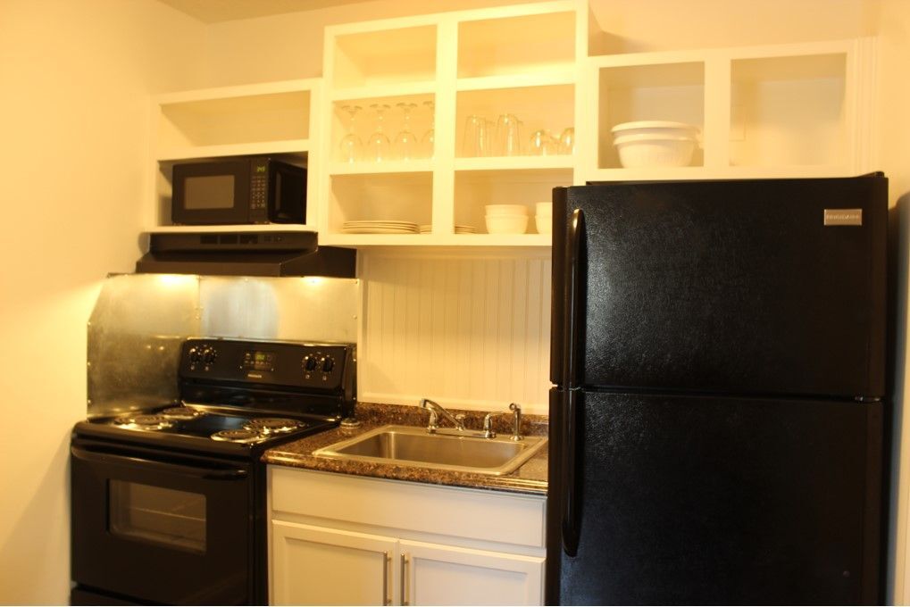 There is a fully stocked kitchen with everything you need to cook and eat! - 3813 Gallatin Pike