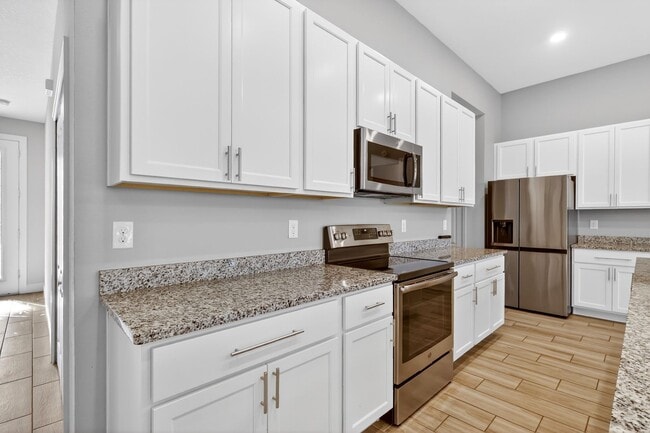 Building Photo - Modern 4-Bedroom Rental with Screened Patio & 2-Car Garage