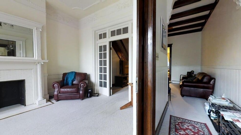 LIVING ROOM and FRONT ENTRANCE HALLWAY WITH VIEW TO WELCOME SPACE - 2937 N Charles St