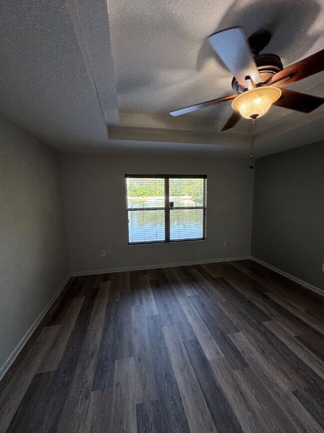 Building Photo - Spacious 4 Bedroom Pond-View Home with Upg...