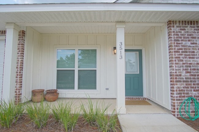 Building Photo - Gulf Breeze 3BR/2BA Townhome – Vaulted Cei...