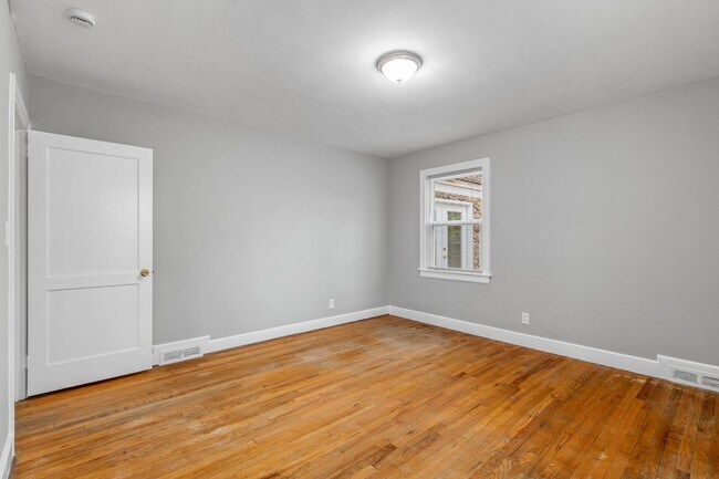 Building Photo - Brick home, Two Story, Hardwoods, DR, 2 Sun Rooms, FP, Carport!.