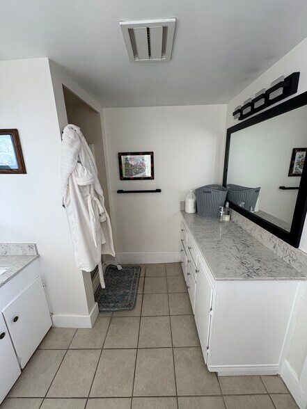 Quarts counter tops in large walk in bathroom with vanity and storage! Rare find for a studio! - 125 26th St