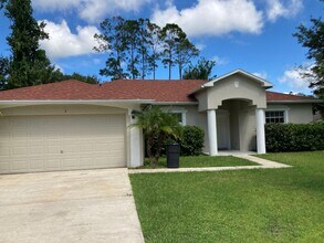 Building Photo - Spacious 4/2/2 Home with Screened-In Porch...