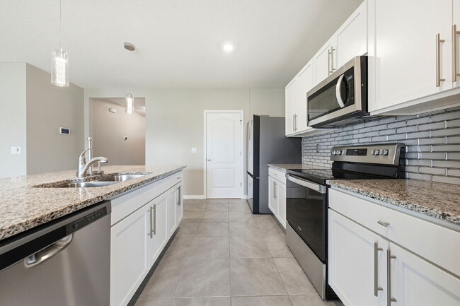 Building Photo - Three Bedroom, 2 Bathroom single family home with 2 Car Garage.