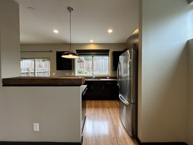 Building Photo - Charming 3 Bedroom, 2.5 Bathroom Home with Large Living Room, Tall Windows, Island Kitchen, and A...