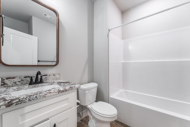 Building Photo - Welcome to this stunning 3-bedroom, 2-bathroom home that boasts a range of high-quality features ...